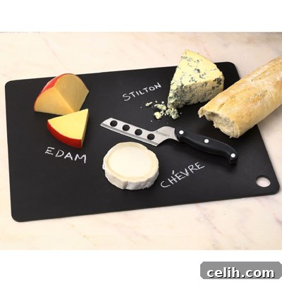 Recycled Cardboard Chopping Board Stylish black chopping board made from 100% recycled cardboard, resembling natural slate, resting on a kitchen counter.