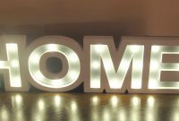 Enchanting Glow A White Wooden Home Sign