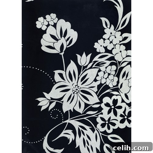 Monsoon Elise contemporary floral wallpaper Monsoon Elise wallpaper, a charcoal background with stylized white flowers