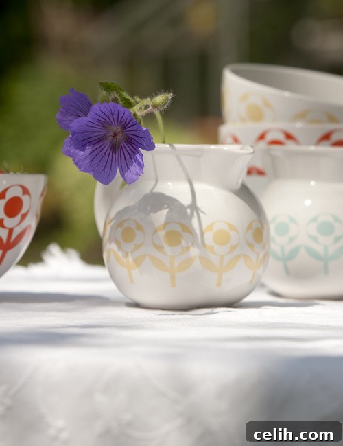 Set of daisy patterned jugs, showcasing various joyful colours like orange, yellow, and blue