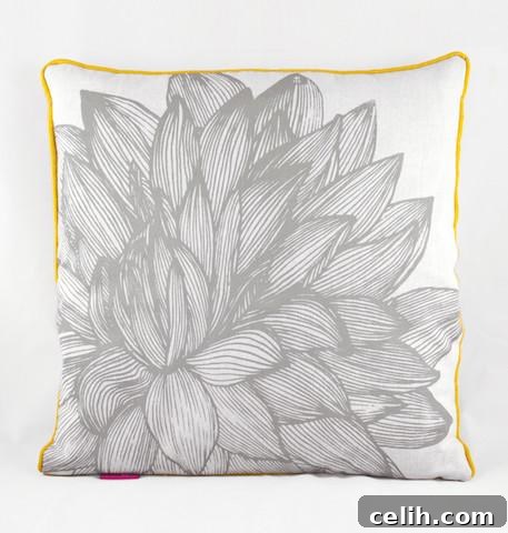 Square grey cushion featuring a distinctive flower design