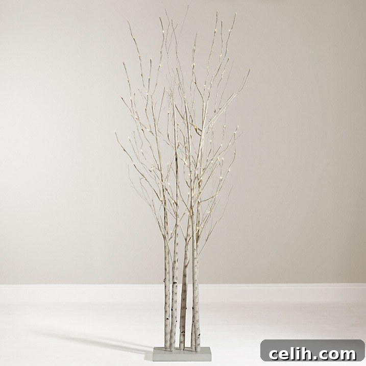 Natural Birch Christmas Tree Clusters 2 A beautifully illuminated pre-lit LED birch cluster Christmas tree from John Lewis, perfect for a subtle and elegant festive display with its natural stand.