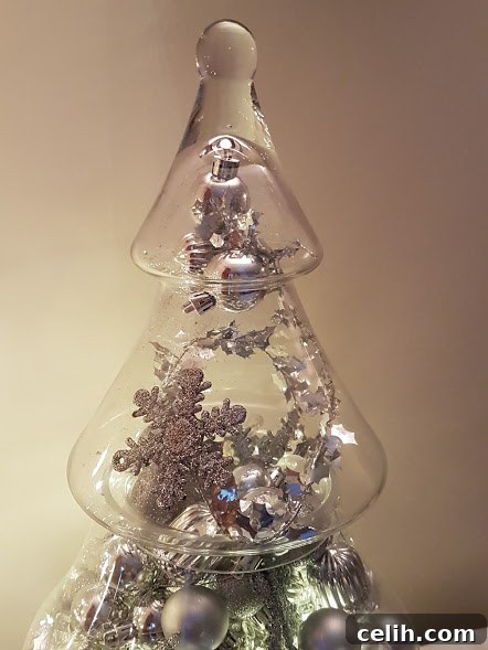 Effortless Seasonal Sparkle: Your Glass Christmas Tree Jar Display 4 Lovely idea for styling a glass Christmas tree jar with a metallic silver theme