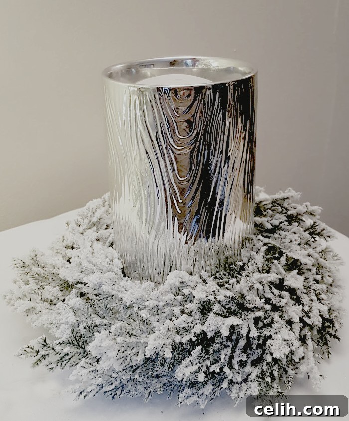 Christmas scented candle and frosted wreath - great for a table decoration