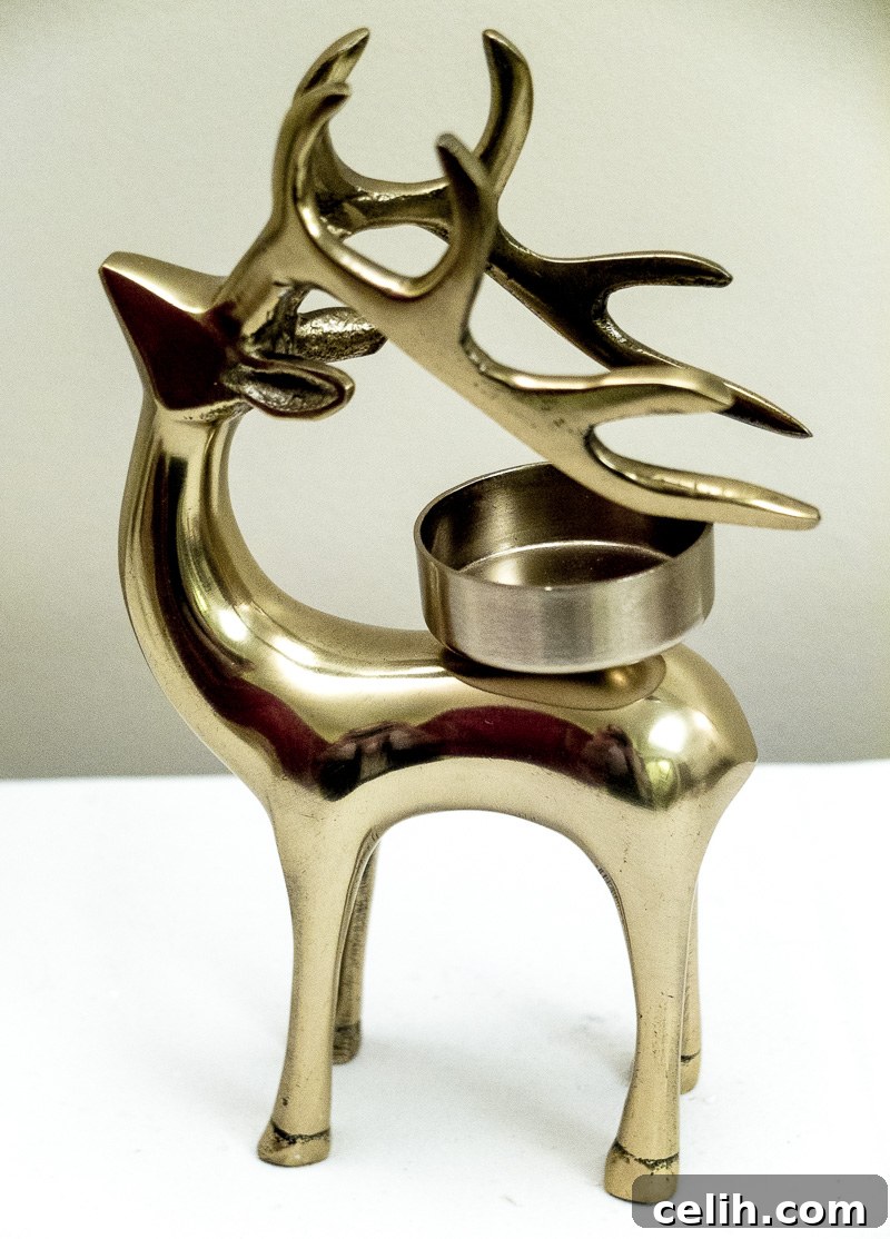 Gold reindeer design candle holder for festive warmth