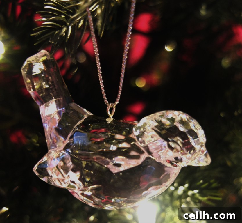 Balsam Hill: Crafting Unforgettable Christmas Memories 3 Close-up of a sparkling crystal bird tree decoration on the Fresh Design Blog Christmas tree