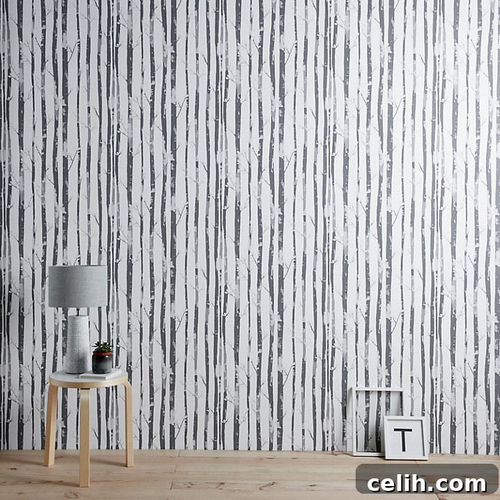 Inject a touch of Scandinavia into your home with this gorgeous forest monochrome wallpaper, perfect for a calming retreat.