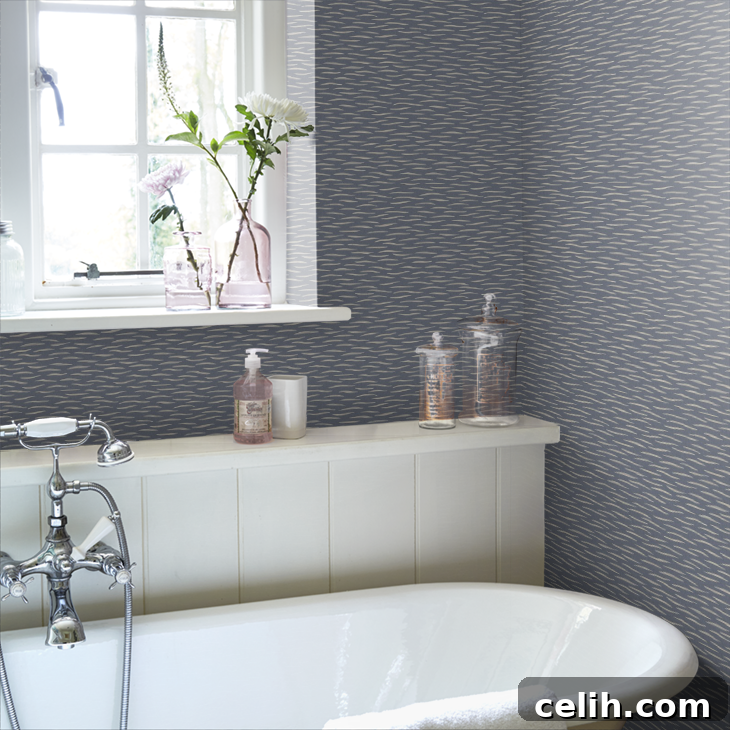 Ink blue River wallpaper, featuring a fluid design echoing the tranquil movement of a river. Perfect for a calming bathroom.