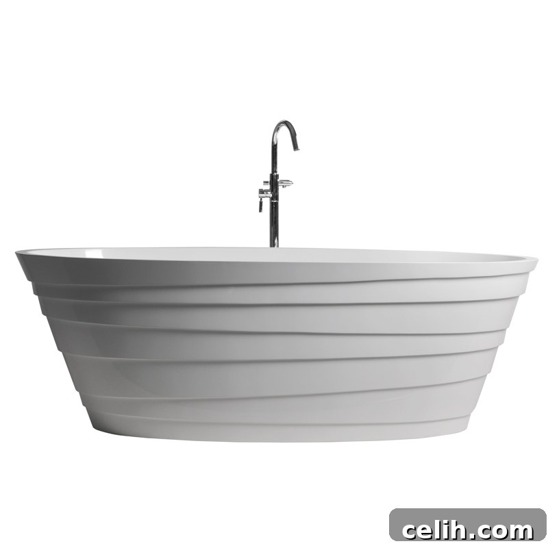 An eye-catching Rossi double ended freestanding bath with an unusual geometric pattern design on its exterior, made from S-Cast resin, perfect for unique bathroom styles.