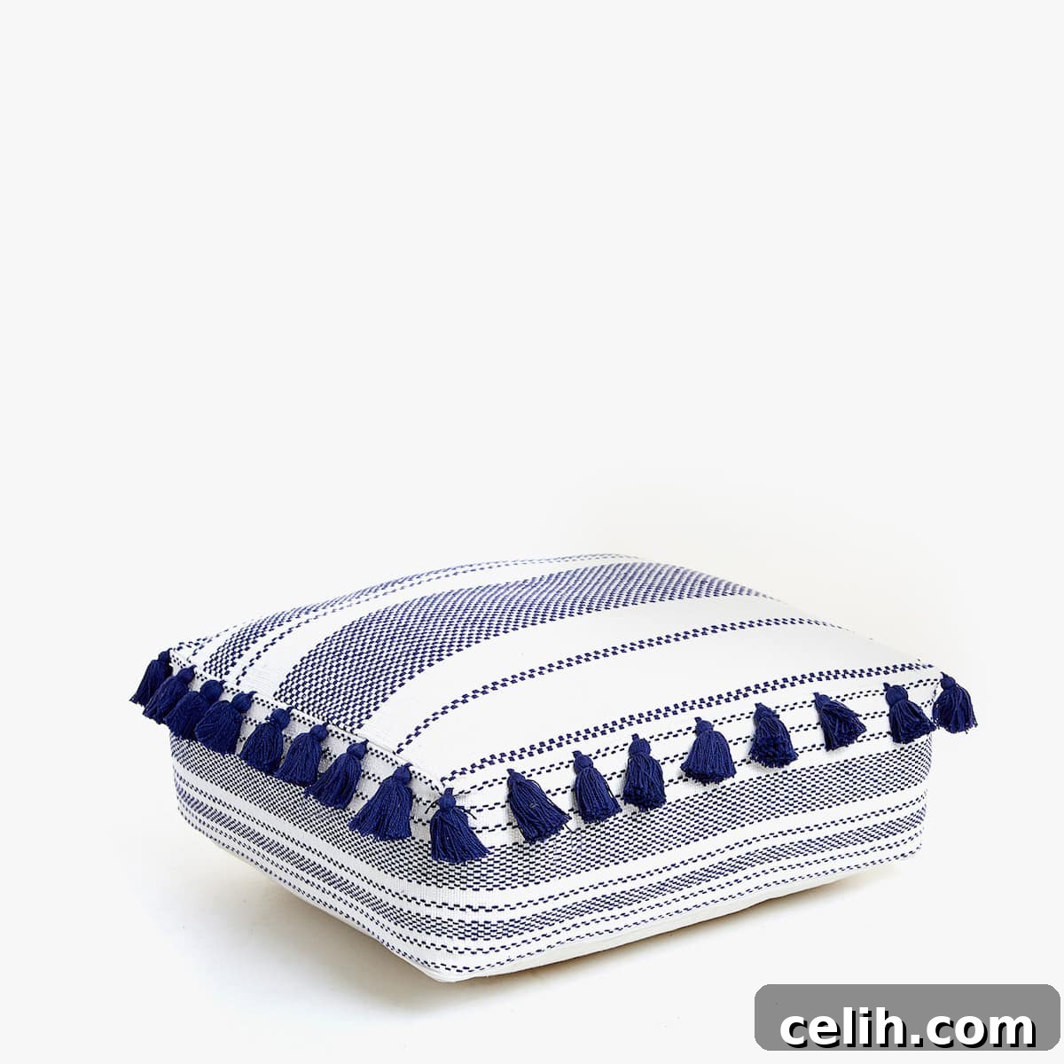 Stylish blue and white square cotton pouffe with tassels, perfect for extra seating or a footstool, from Zara Home.