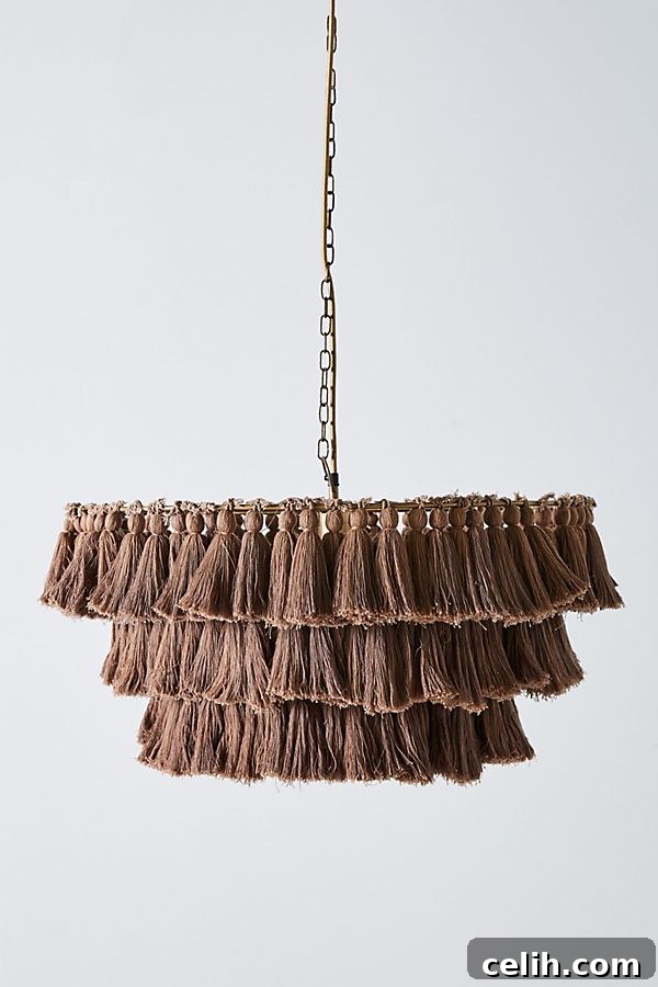 Stunning Fela tasselled chandelier by Justina Blakeney for Anthropologie, bringing bohemian charm to any interior.
