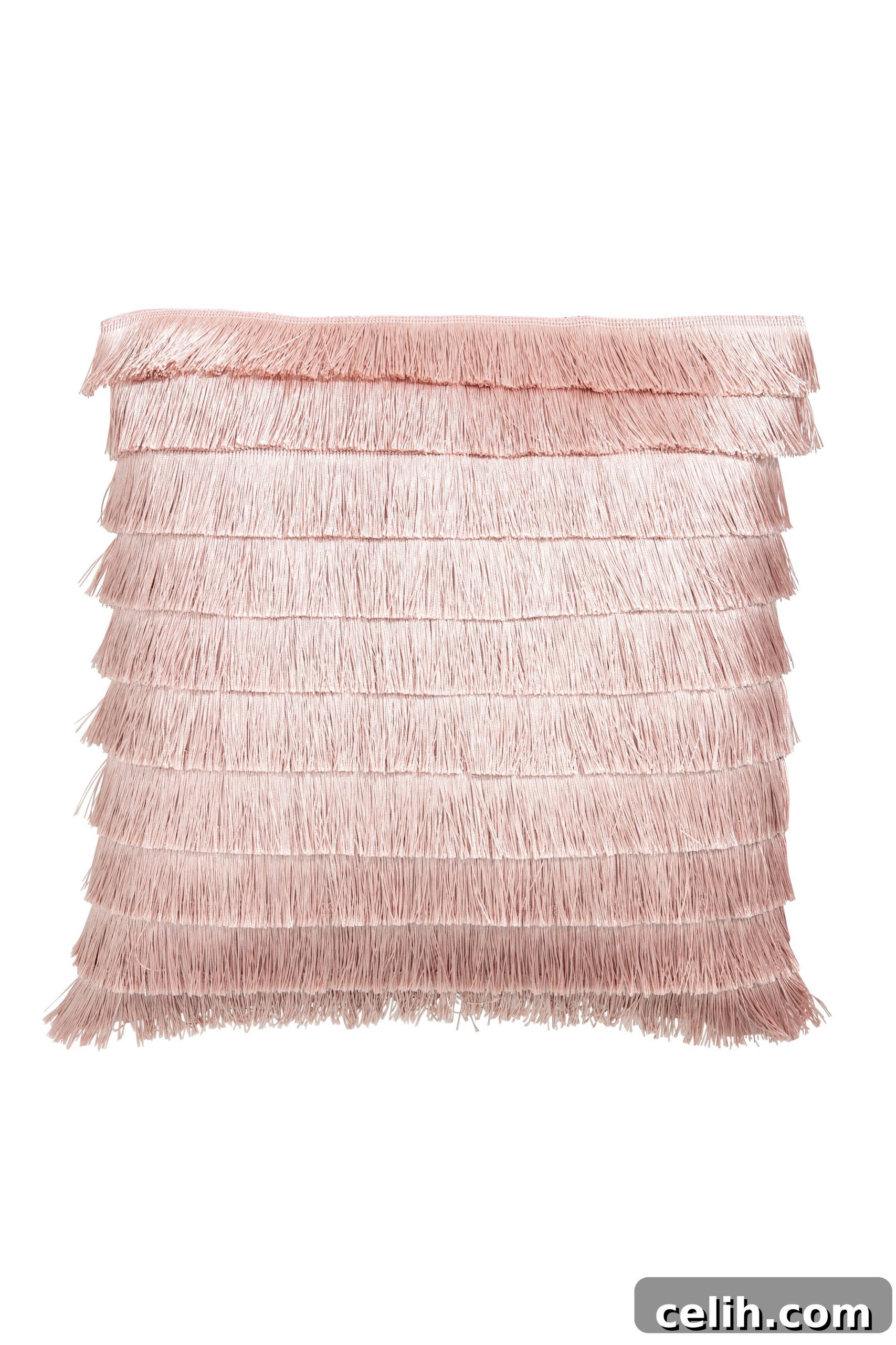 Trendy fringed cushion cover from H&M, available in light pink, light grey, and gold, perfect for updating sofa decor.