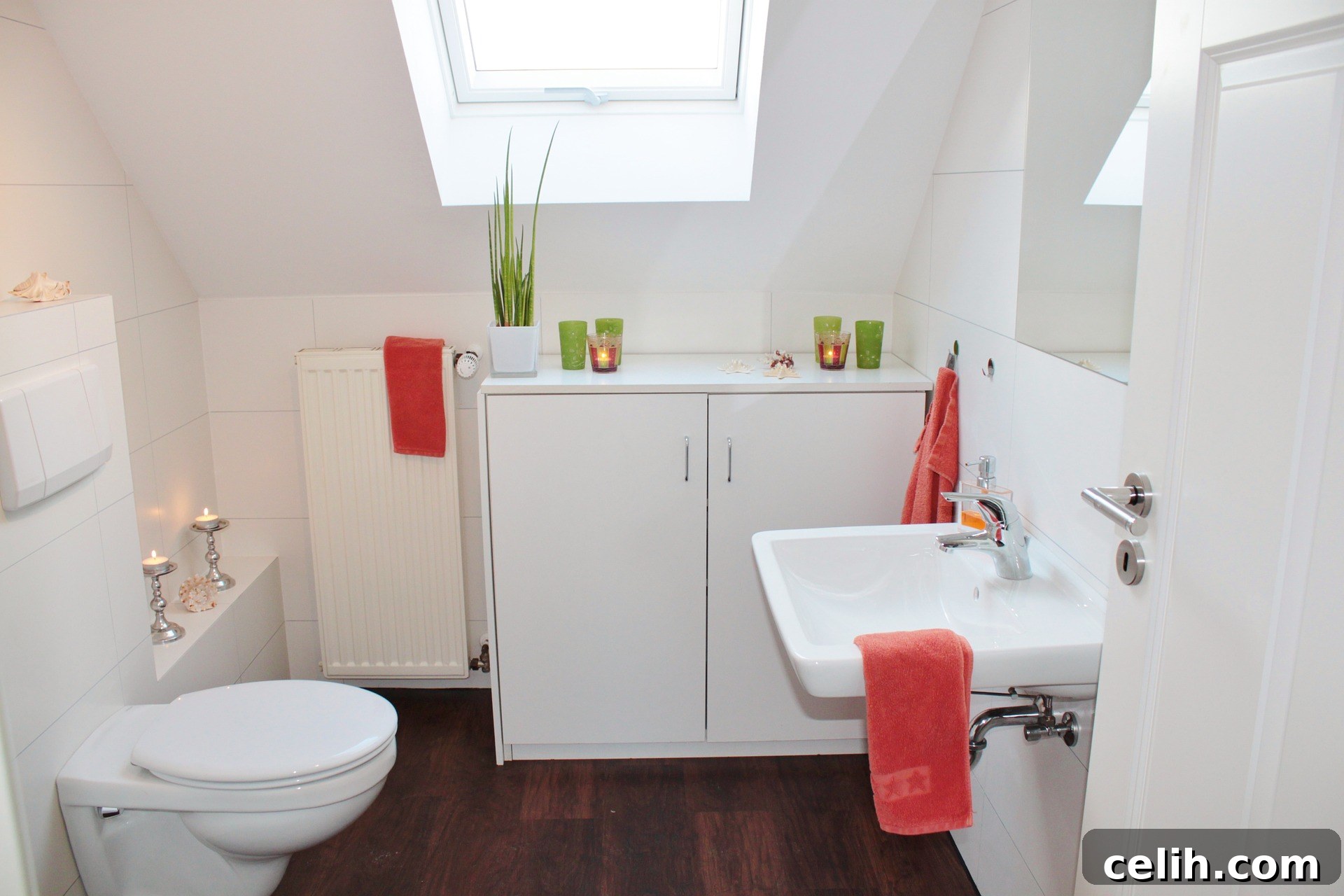 Add some colour to a white bathroom through the use of towels, soap dishes, and other accessories