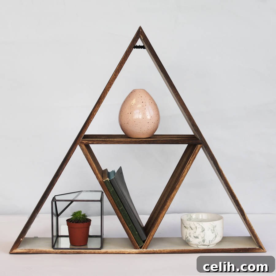 Use this eye-catching triangle geometric shelf to display your favourite small ornaments and treasures