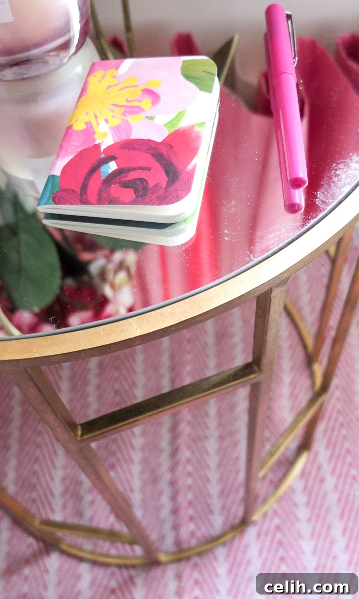Close-up detail of the elegant geometric base of the gold Safavieh side table, showcasing its intricate design and luxurious metallic finish