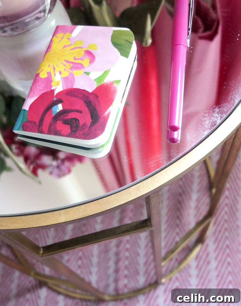 A close-up view highlighting the beautiful reflective mirrored top of the gold geometric side table, adding brightness and depth