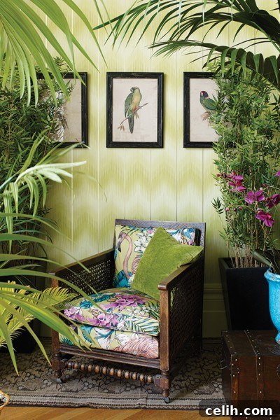 Matthew Williamson wallpaper and fabric in harmonious blue, green, and pink tones, ideal for plantation style.