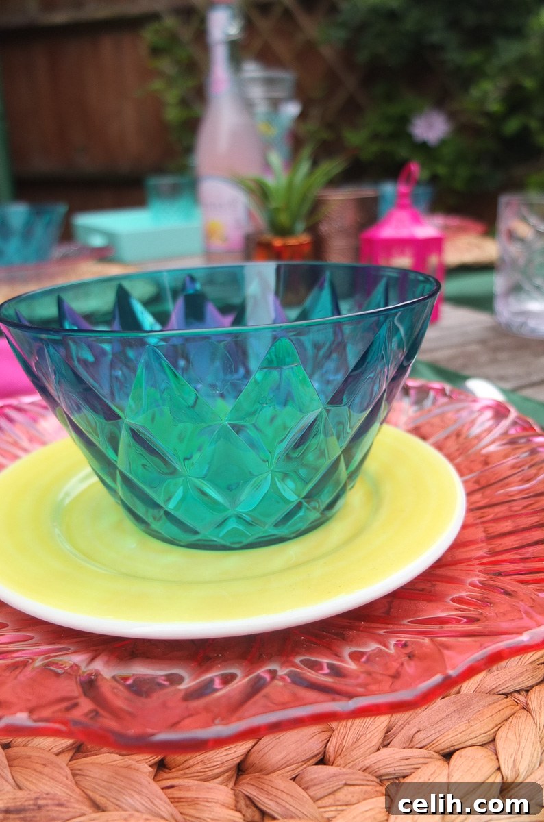 Green Koziol designer alfresco dining bowls for stylish outdoor meals.