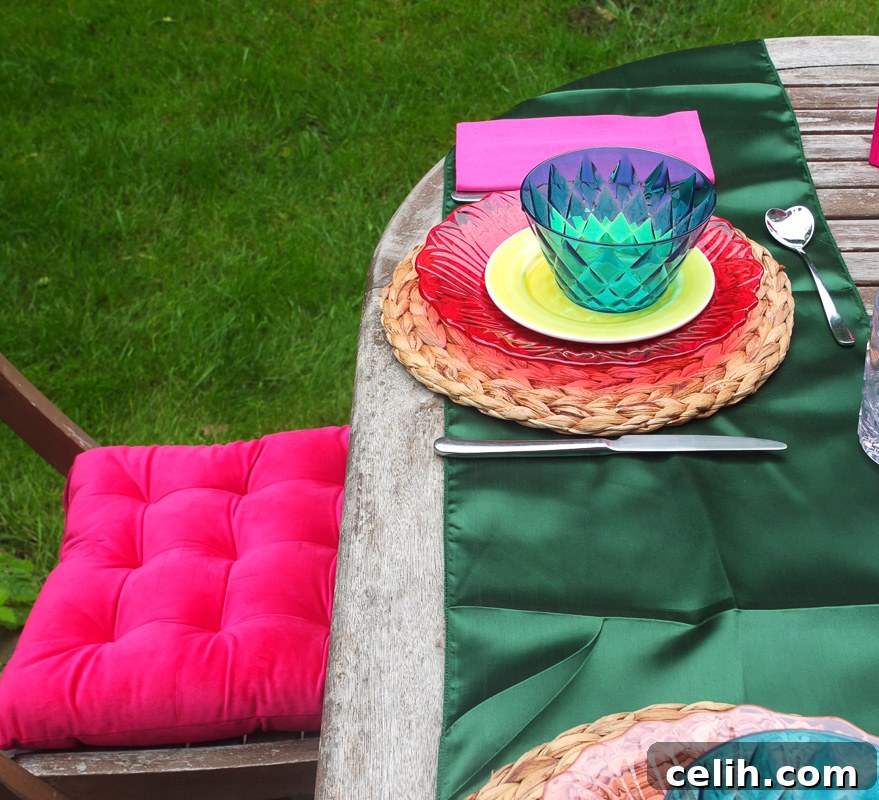 Gorgeous rich pink velvet chair cushions adding a luxurious feel to garden chairs.