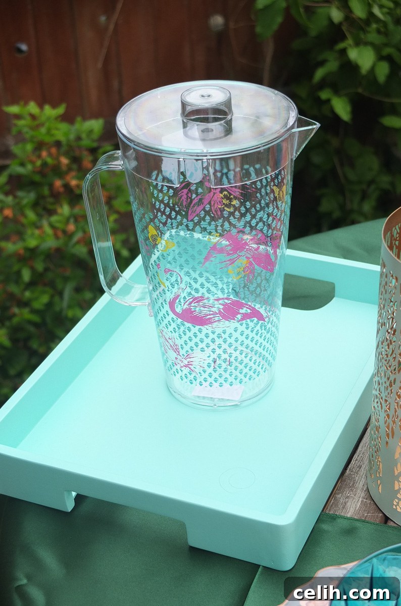 Carry items safely outside on a wooden tray and use this flamingo design plastic jug to serve up delicious ice cold drinks.