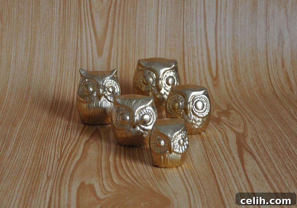 Close-up of Glossy Gold Owls Decor