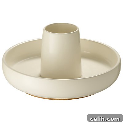 Sebastian Conran Lazy Susan Utensil Pot A stylish ceramic utensil pot with a bamboo lazy Susan base, featuring various kitchen utensils, designed by Sebastian Conran for efficient kitchen organization.
