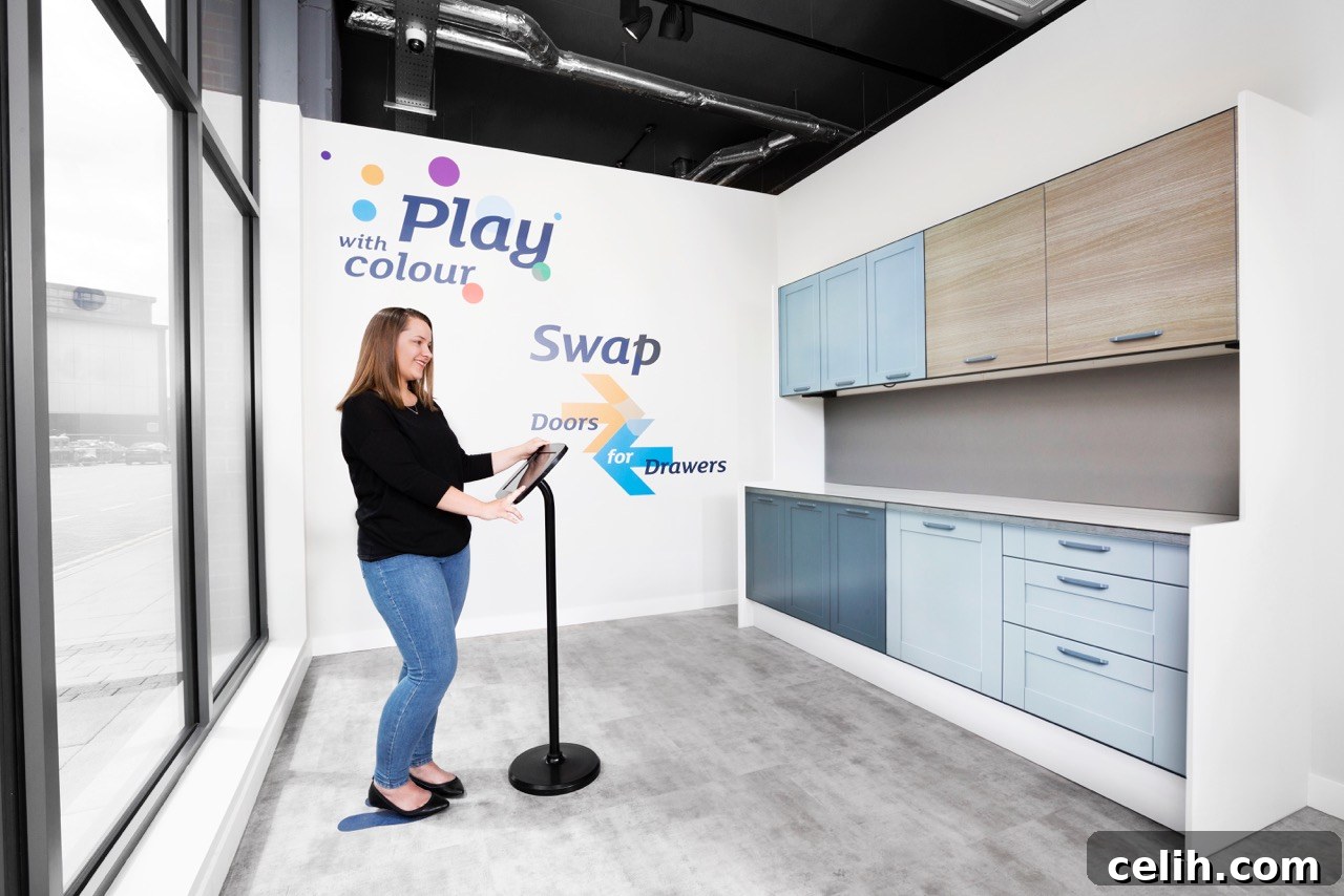 Clever digital kitchen display area in the Magnet showroom in Sutton, Surrey. High-definition screens replace physical cabinet doors, showing various design options.