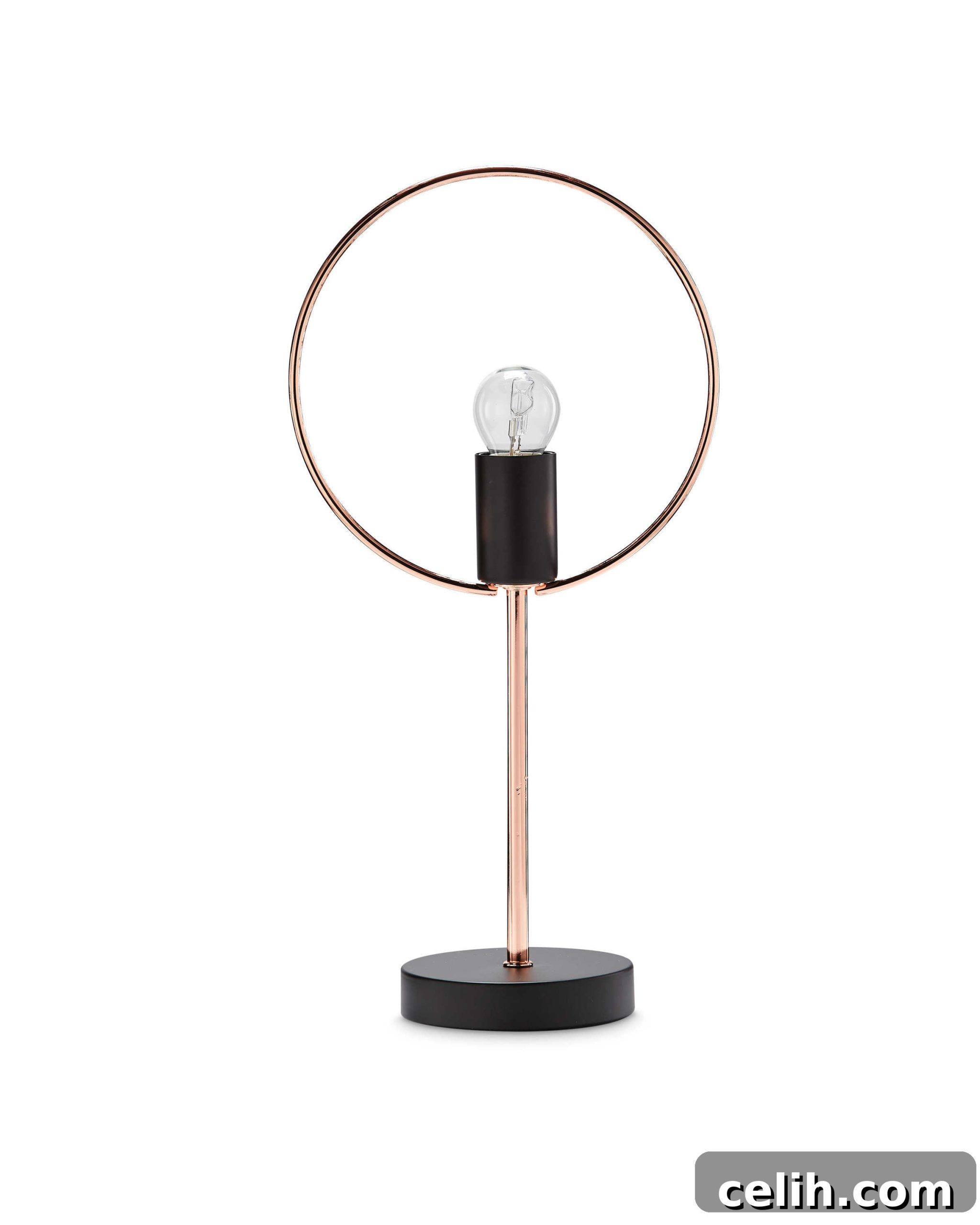 A chic copper and black circular design table lamp from Aldi, perfect for modern interiors.