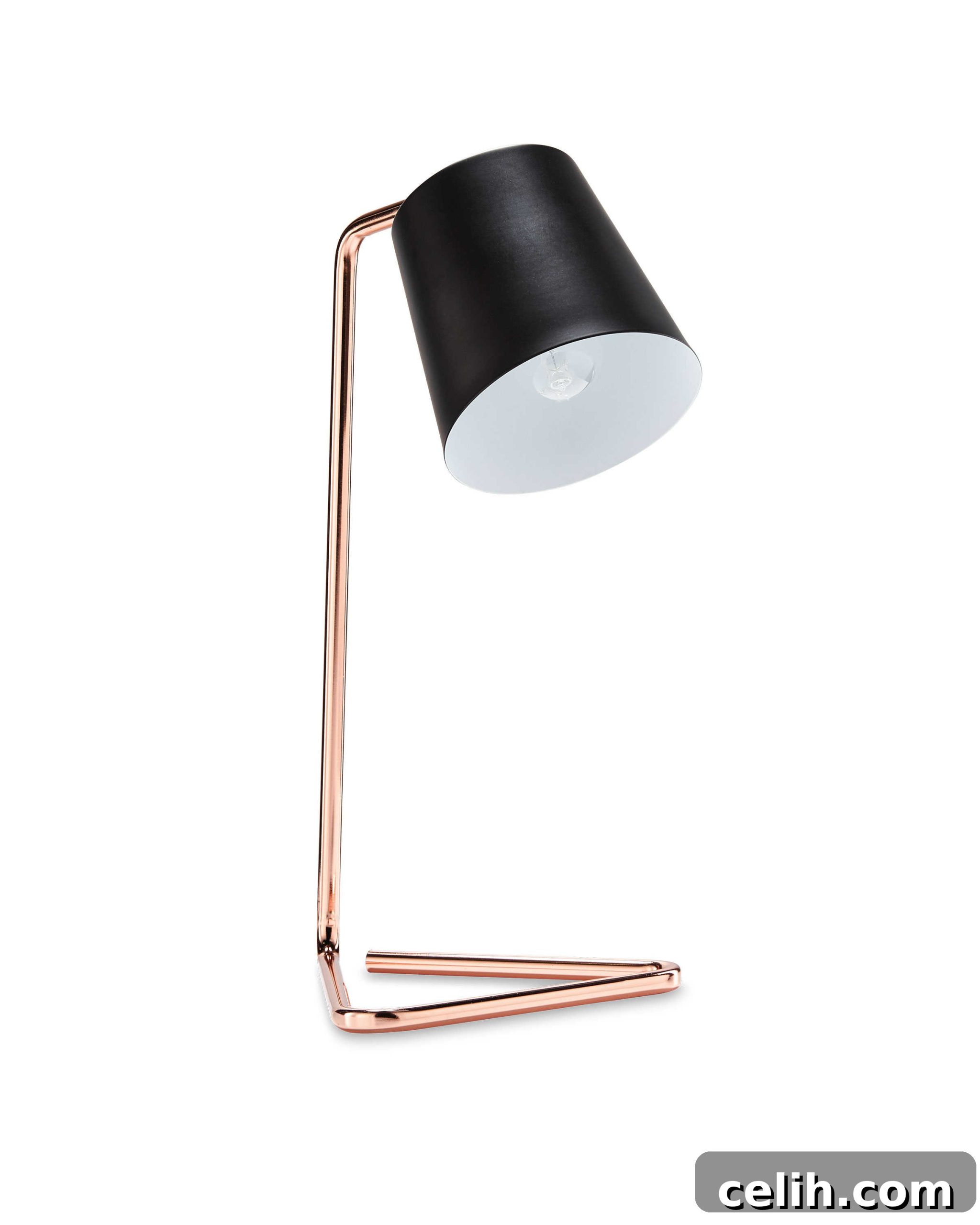 A charming compact table lamp in copper and black, perfect for small spaces or bedside tables.