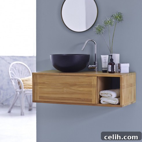 Gorgeous solid teak wood suspended bathroom washstand, ideal for creating a floating, airy aesthetic in compact bathrooms.
