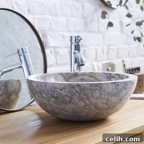 Love this chic and minimalist 100% natural marble stone washbasin, showcasing unique grey veining for a luxurious touch.