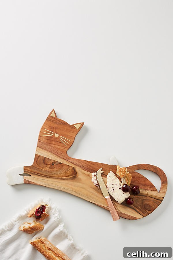 One for feline fans! The house cat cheese board is delightful, a charming wooden serving platter shaped like a cat, perfect for entertaining and animal lovers.