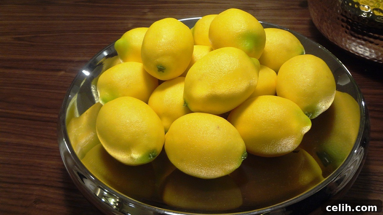 A vibrant bowl of fresh lemons on a kitchen counter, adding a pop of natural color and freshness to the home decor.