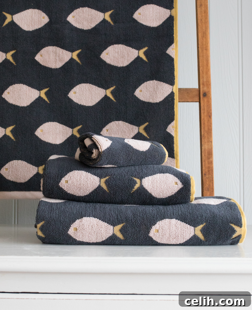 Beautiful fish design bathroom towels from Anorak's Sea Life collection in a fresh colourway