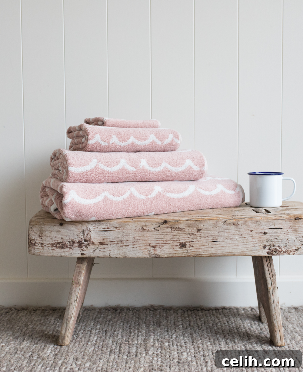 Chic dusty pink wave design bathroom towels from Anorak, blending elegance with marine inspiration