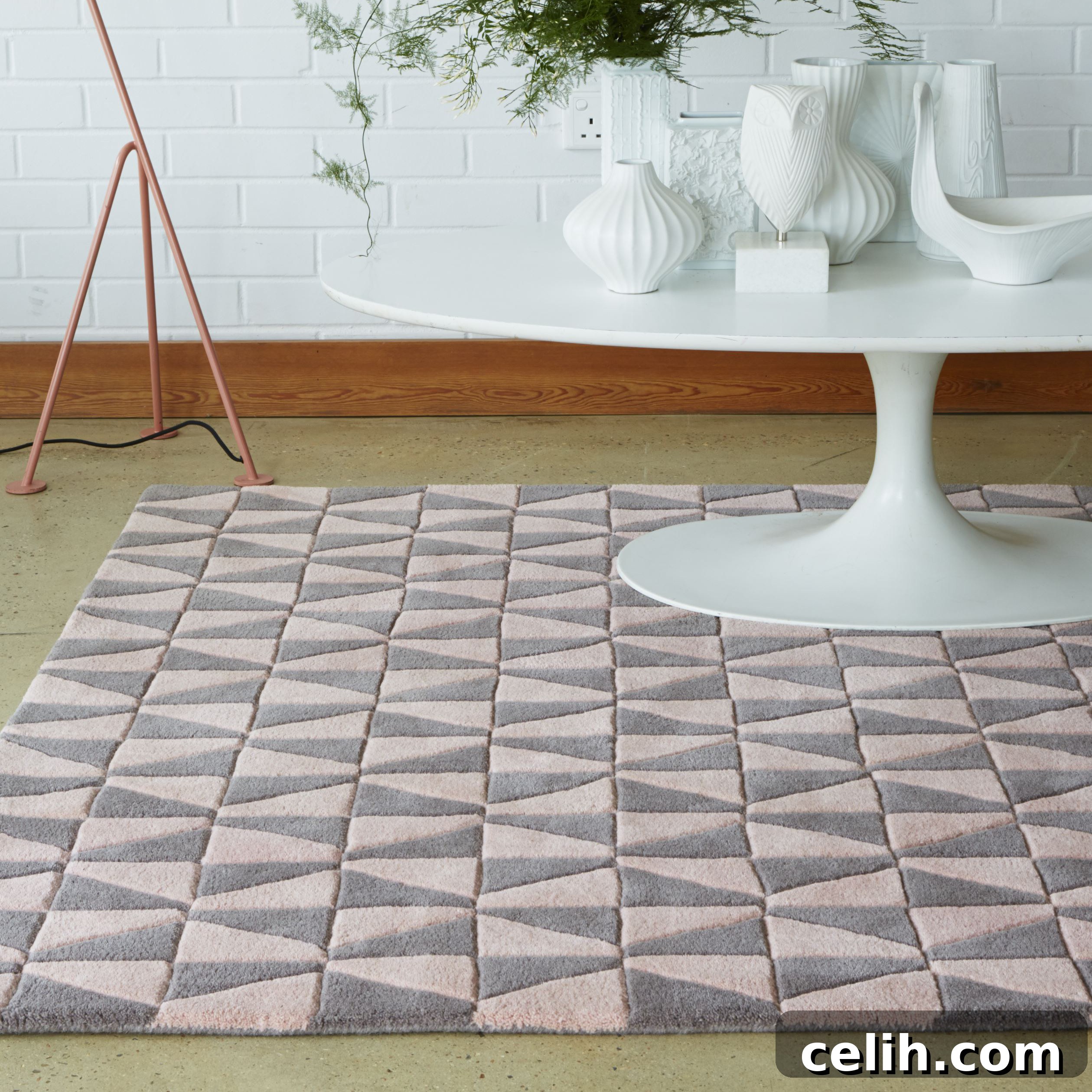 Modern stylish rug in pink and grey with a geometric pattern, adding instant impact to any room