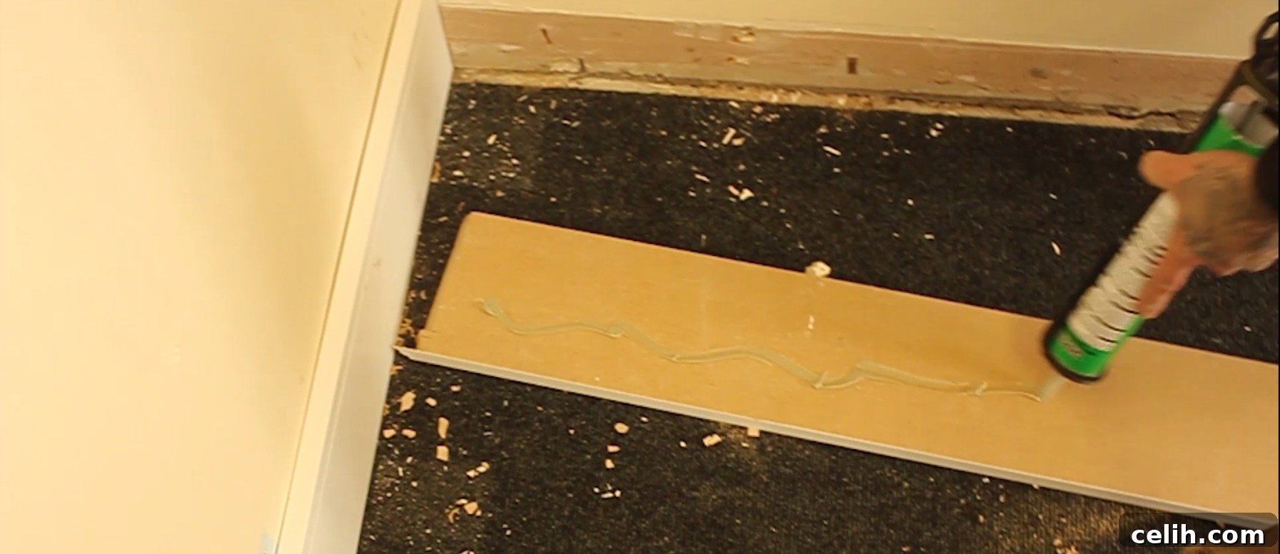 Learn how to effectively fit skirting board in your home - applying adhesive