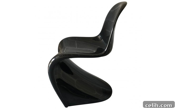 The groundbreaking Verner Panton S Chair, the first cantilever chair made from a single piece of molded plastic, showcasing its iconic S-shape and smooth form.
