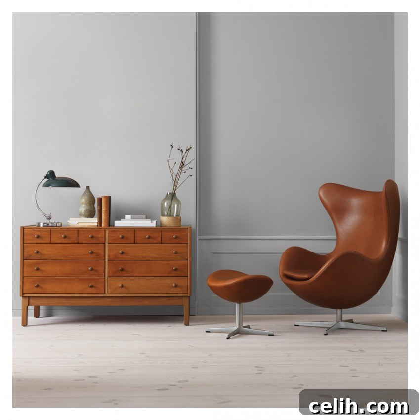 The iconic Arne Jacobsen Egg Chair, seen here in elegant leather upholstery, providing a distinctive and private seating experience.