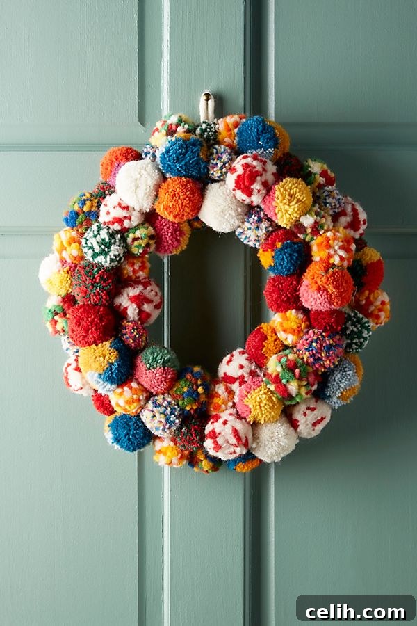 Deck the Halls with Amazing Christmas Wreath Hanging Ideas 6 Vibrant Pom Bonanza Christmas wreath, adorned with an explosion of colorful hand-felted pom poms in various bright hues, offering a cozy and unique texture. A handcrafted decorative piece from Anthropologie.