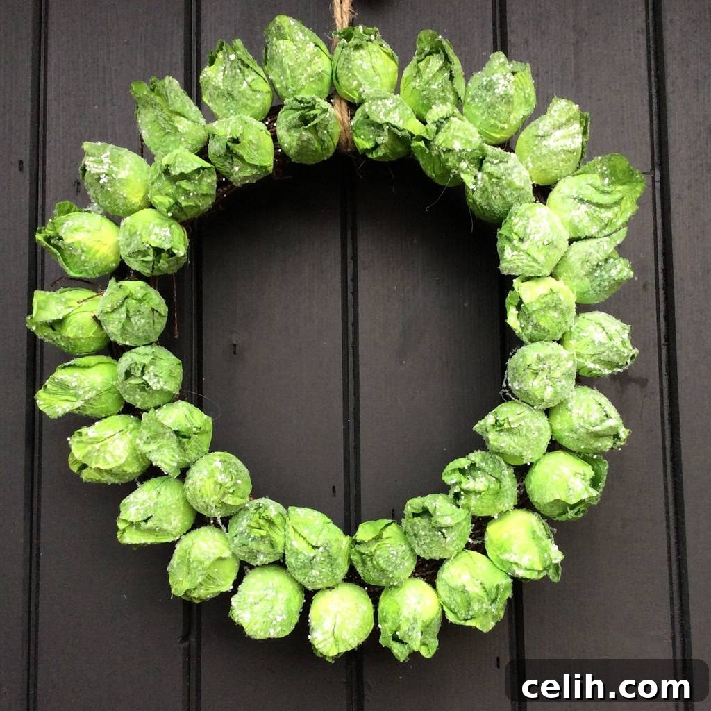 Deck the Halls with Amazing Christmas Wreath Hanging Ideas 5 Funky and realistic round Brussel sprout wreath, handmade from paper, perfect for a quirky and humorous Christmas door decoration.
