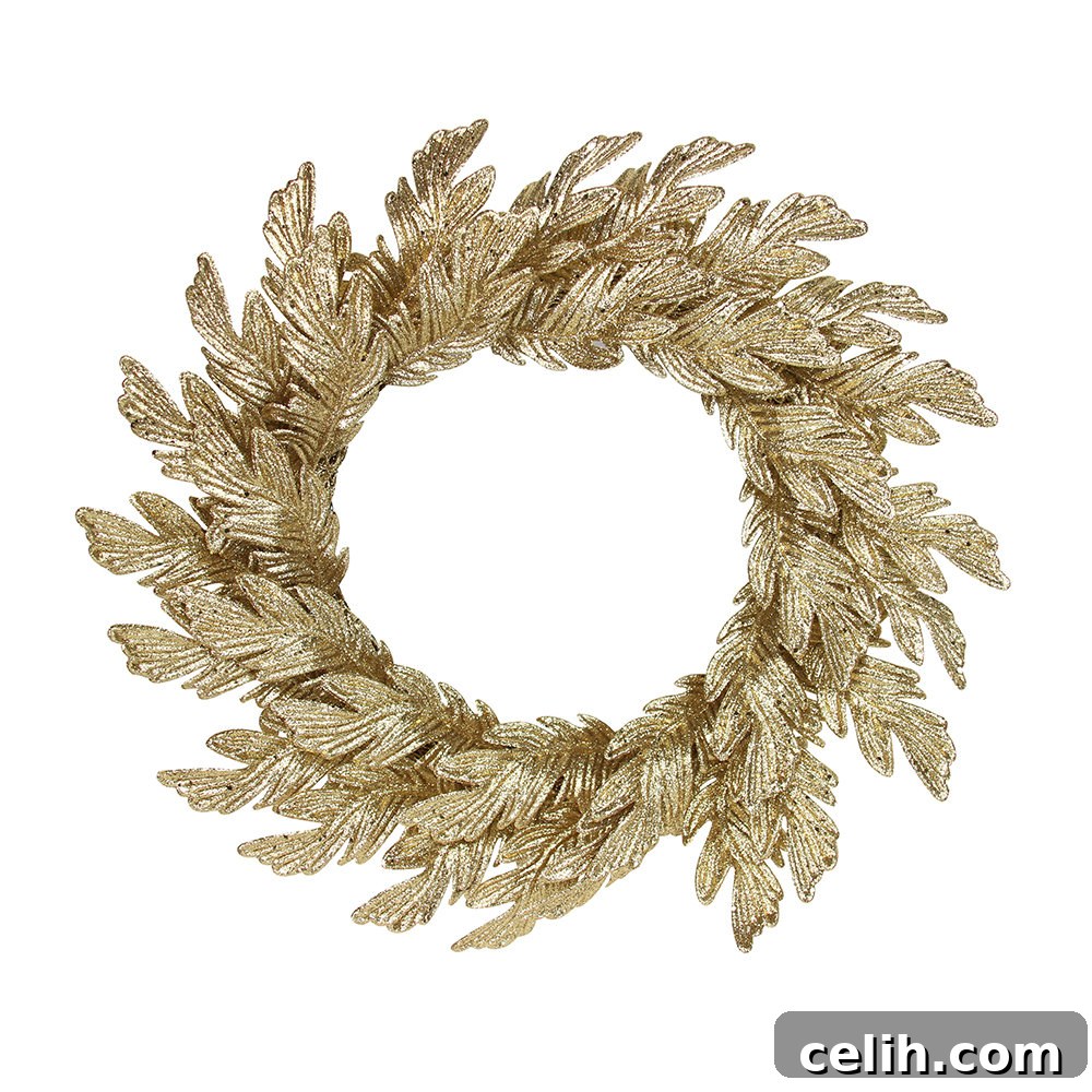 Deck the Halls with Amazing Christmas Wreath Hanging Ideas 11 Elegant champagne gold glittered oak leaf design Christmas wreath by Gisela Graham, a sophisticated seasonal decoration suitable for hanging or as a table centrepiece.