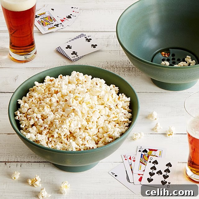 Innovative stoneware popcorn bowl featuring a clever kernel sifter at the base, ensuring a perfect, kernel-free snacking experience for movie nights.