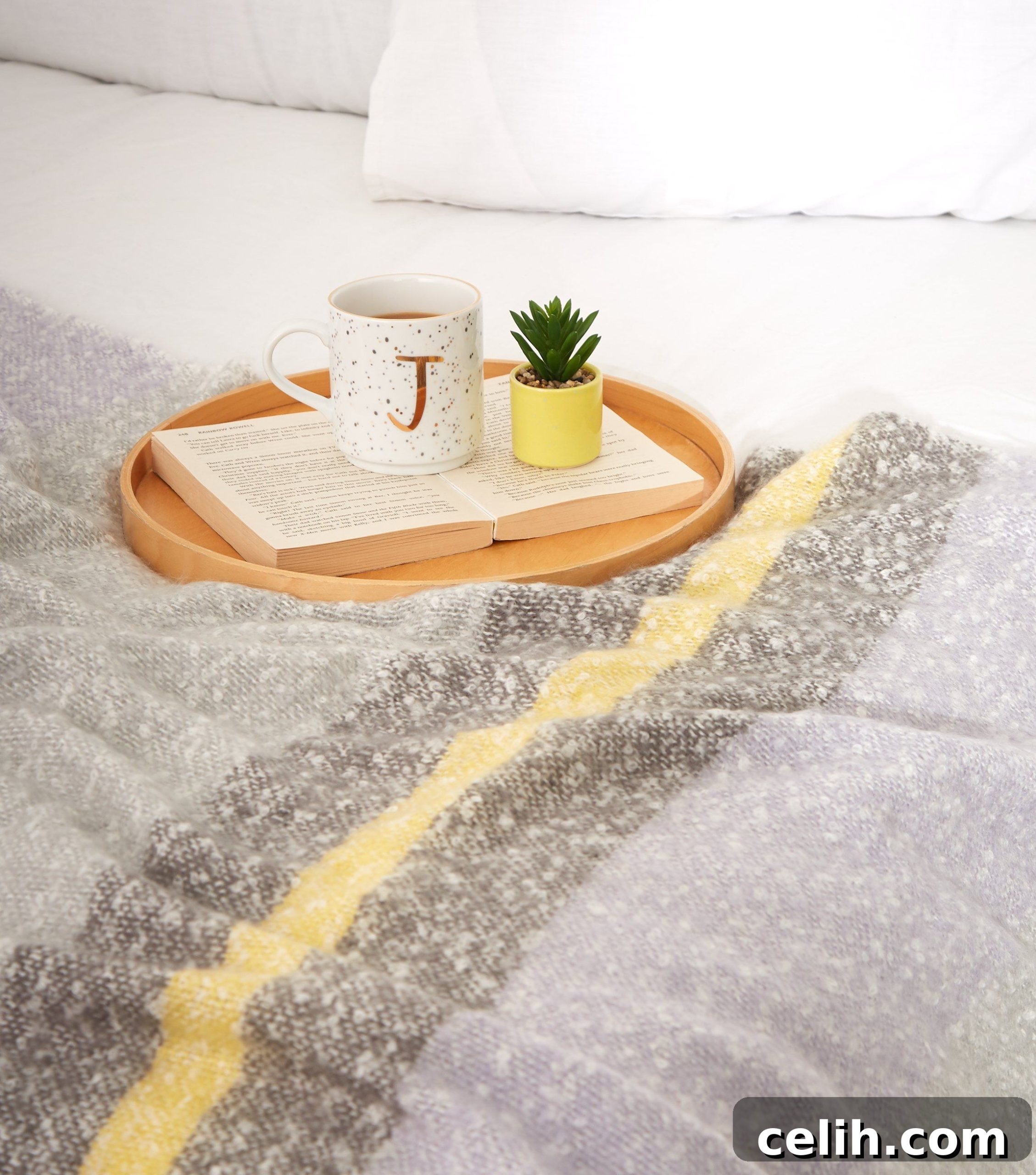 Use this grey pastel block stripe throw on your bed or sofa for an extra cosy layer. It's an affordable homeware idea from New Look, the high street store, so won't break the bank. 