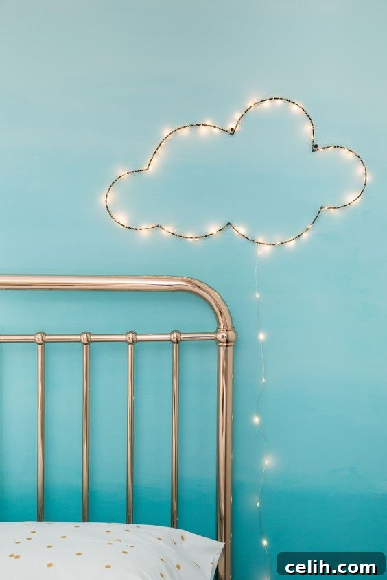Save bedside table space with a creative wall light, like this cloud design, perfect for a child's bedroom.