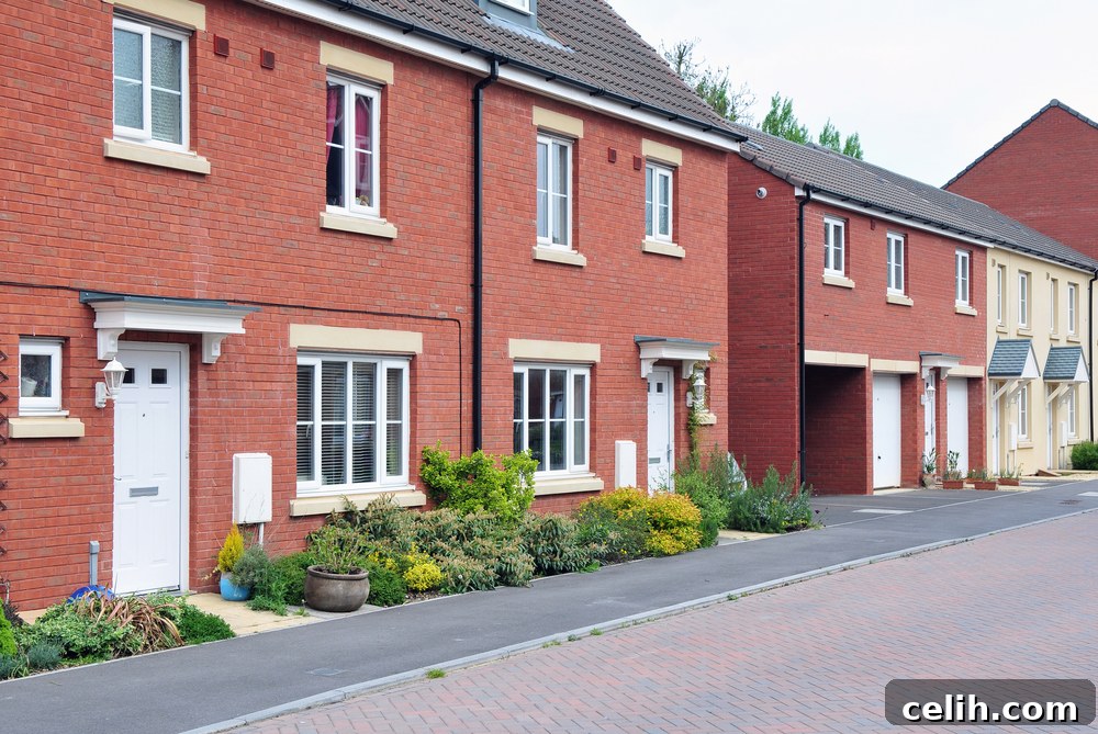 A person shaking hands with an estate agent, symbolizing the transaction and associated fees in moving house