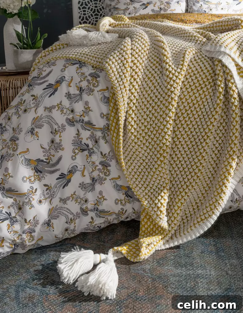 Fat Face Homeware: Must-Have Essentials for Autumn Winter 2019 3 Fat Face Nia Ochre Throw, a two-tone knitted blanket with oversized tassels for adding warmth and style to living spaces