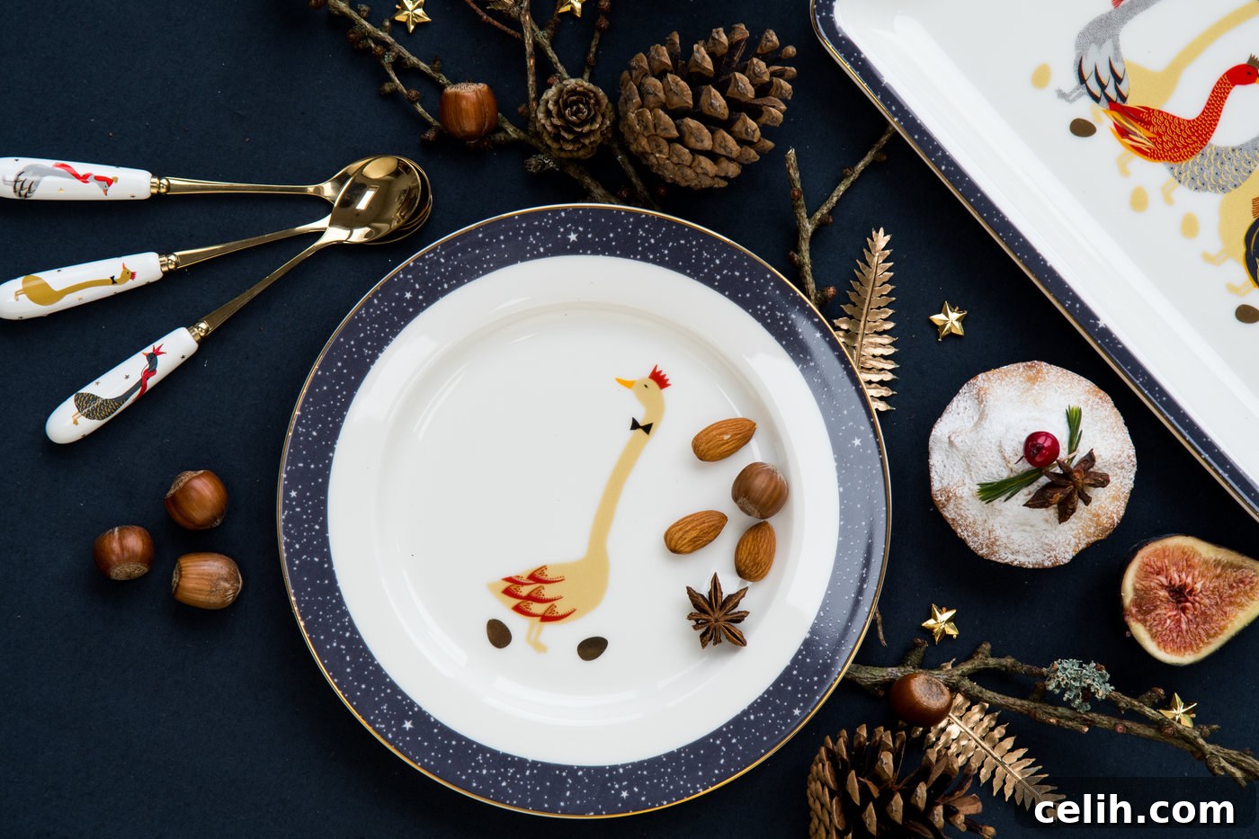 Navy blue Christmas dining table colour scheme with elegant goose plates by Annabel James