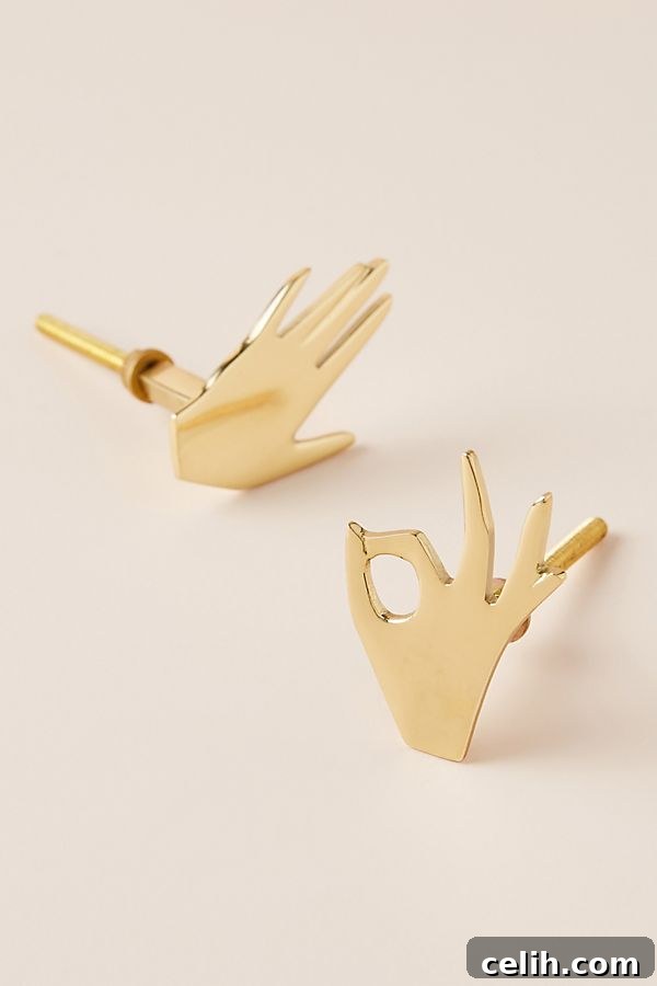 Unusual pair of bronze palmistry hand design knobs, adding a quirky and mystical touch to furniture and cabinets.