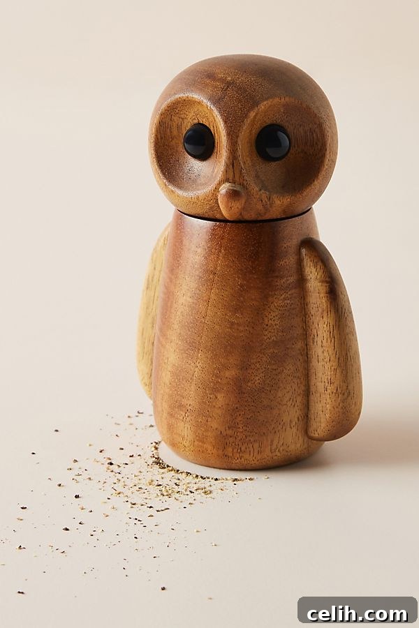 Hand-carved acacia wood owl design pepper grinder, a charming and functional kitchen accessory that combines utility with whimsical decor.